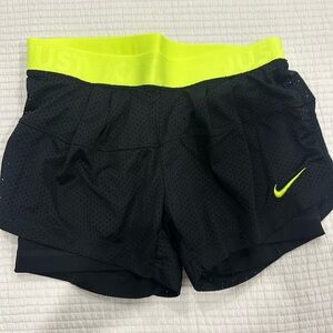 Nike women short shorts for running. Interior fitted short built in.